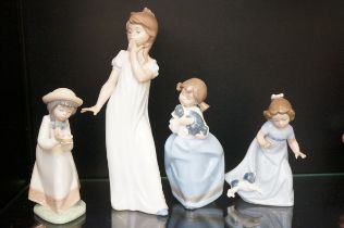 Four Nao child figurines