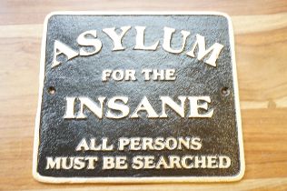 Asylum for the insane cast metal sign