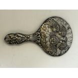 White metal hand mirror