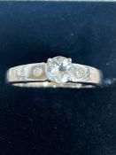 9ct White gold ring set with white sapphire & 2 di