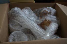 Unsorted box of glass ware