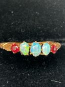 9ct Gold ring set wth 3 opals & 2 garnets Size O 1