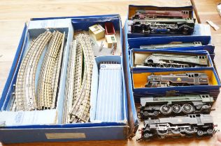 7 Hornby engines together with a box of track