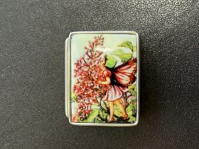 Silver pill box with enamel fairy design