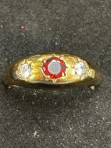 9ct Gold ring set wth 2 white stones & central gar