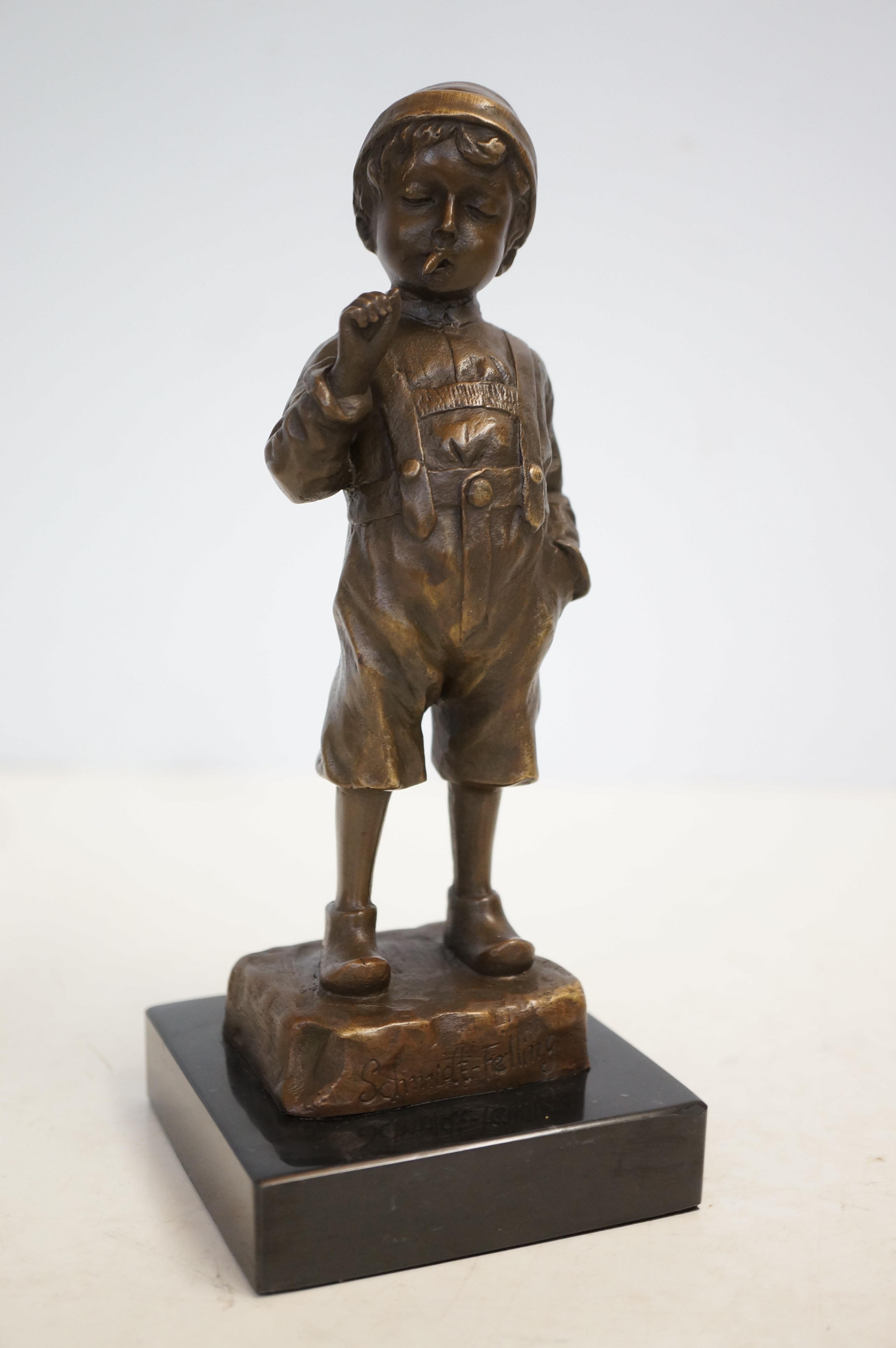 Bronze boy with cigar on marble base signed