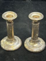 Pair of silver candle sticks (loaded) some bruises