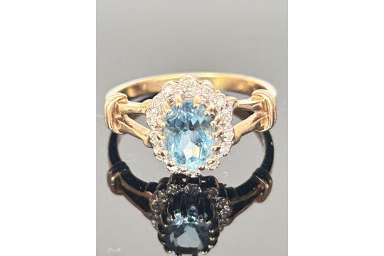 9ct Gold ring set with blue topaz & diamonds Size