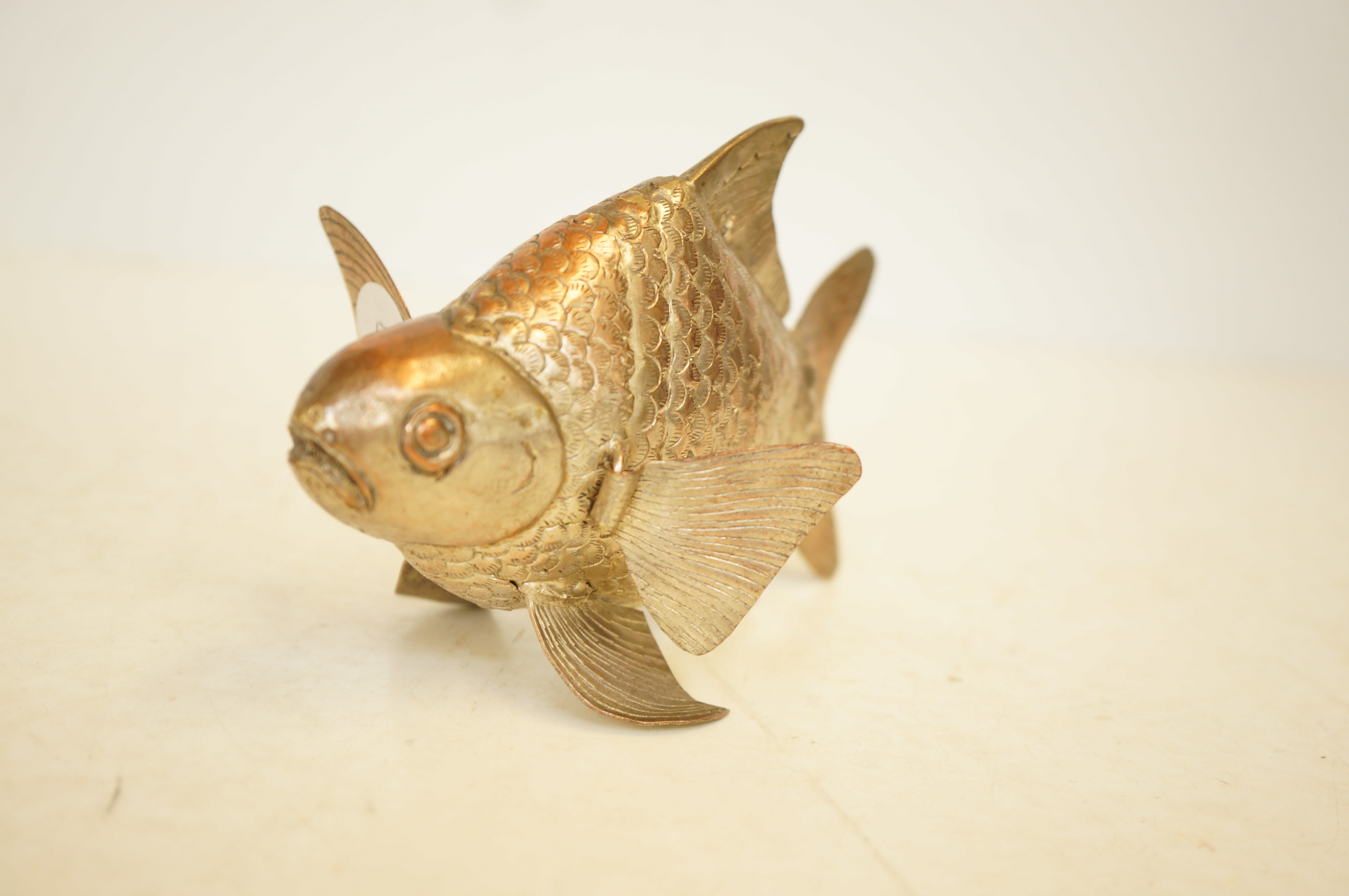 Silver plate on copper movable fish