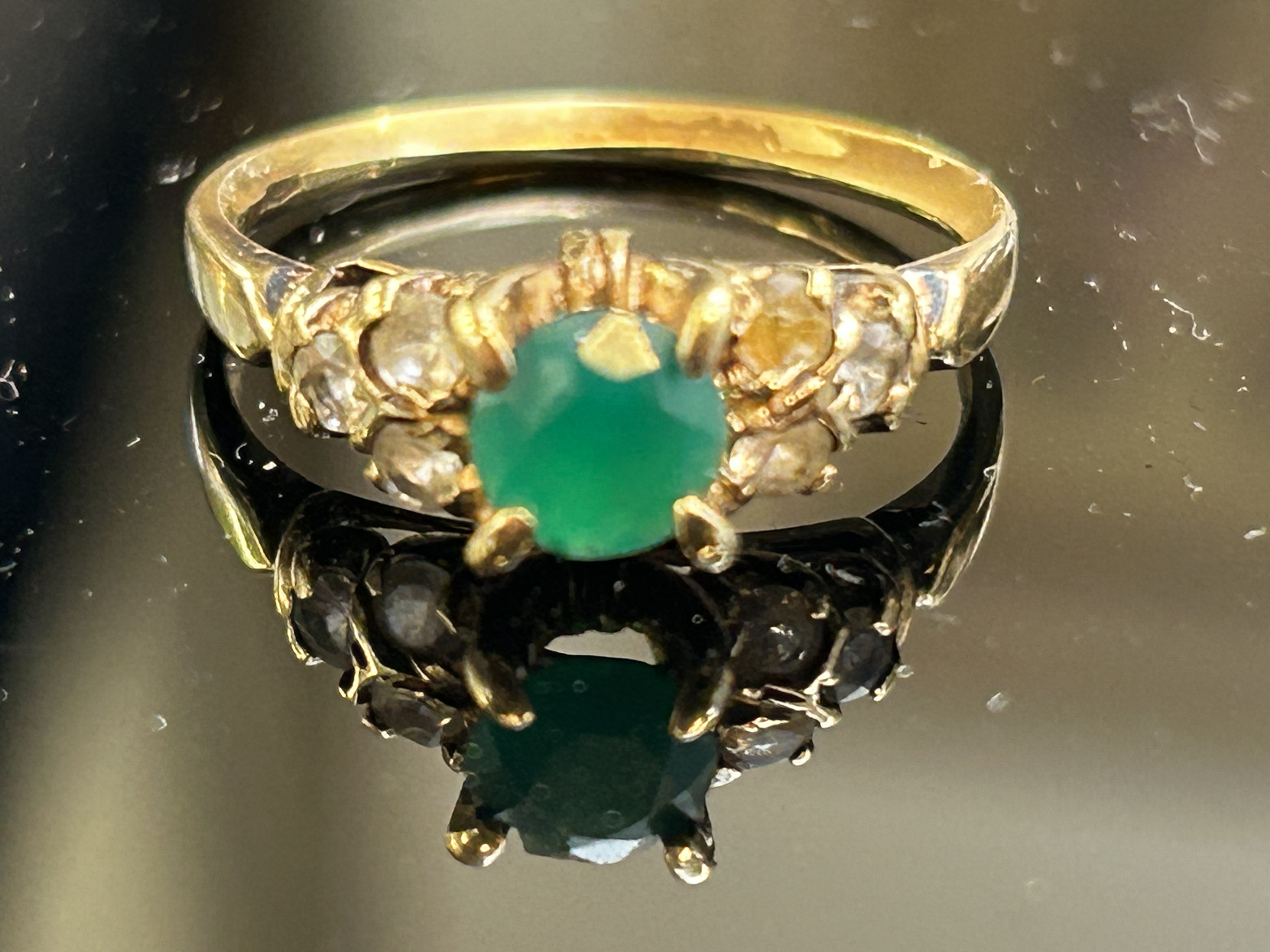 14ct Gold ring set with central emerald and white s