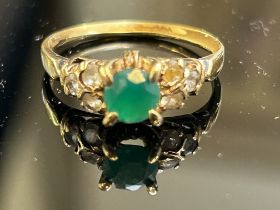 14ct Gold ring set with central emerald and white s