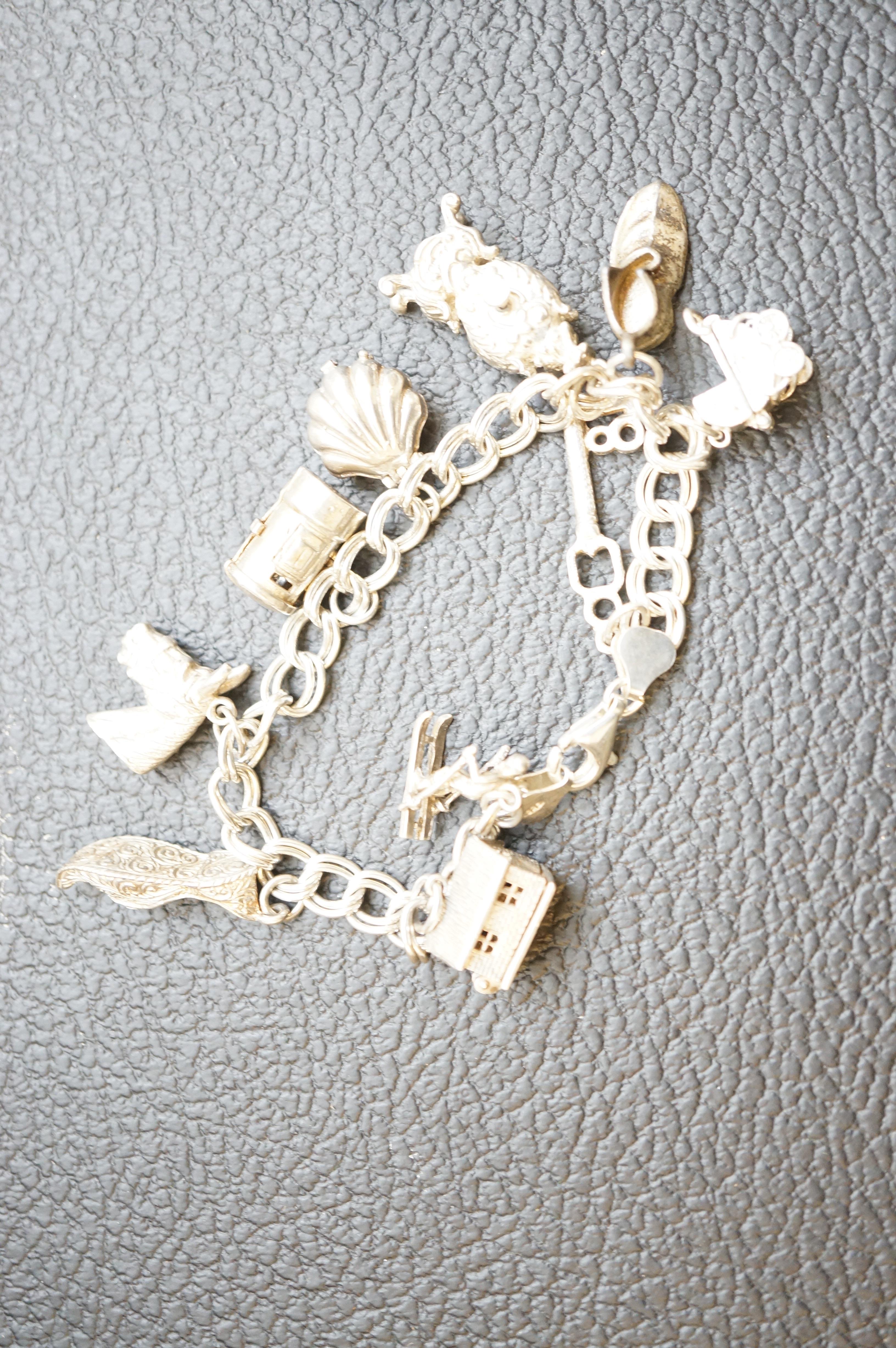 Silver charm bracelet - 10 charms