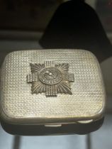 Silver cigarette case with scots guard badge