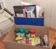 A box containing decorating equipment and overalls