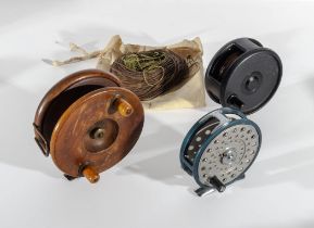 Three fishing reels including a Roddy 320, Shakespeare Alpha 2891 and one other