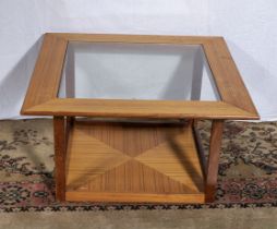 A retro glass topped coffee table