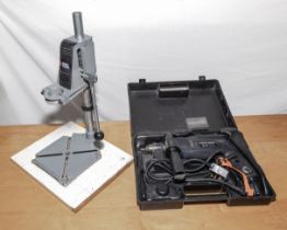 Black & Decker drill together with a drill stand