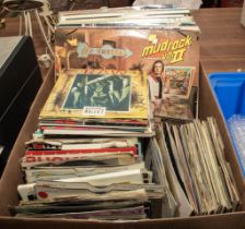 A box of LP records and singles