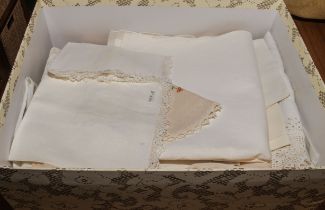 A small box of vintage linen