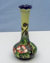 A vase decorated with peonies, mark to base, 20cm tall