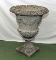 A large reconstituted stone garden urn 58cm dia. x 77cm tall