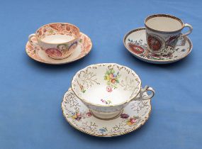 Three cabinet cups and saucers