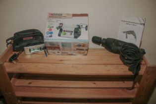 An impact drill together with a modelling double bench grinder and a jigsaw