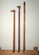 Three walking sticks with animal handles
