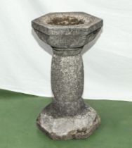 A large reconstituted stone garden bird bath 50cm tall