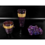 Two purple and gilt glass vases and one other