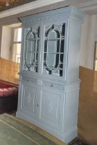 Painted Victorian bookcase on cupboards with bevelled glass astragal doors