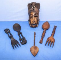 Vintage African carved hardwood salad spoons and forks and a wall mask