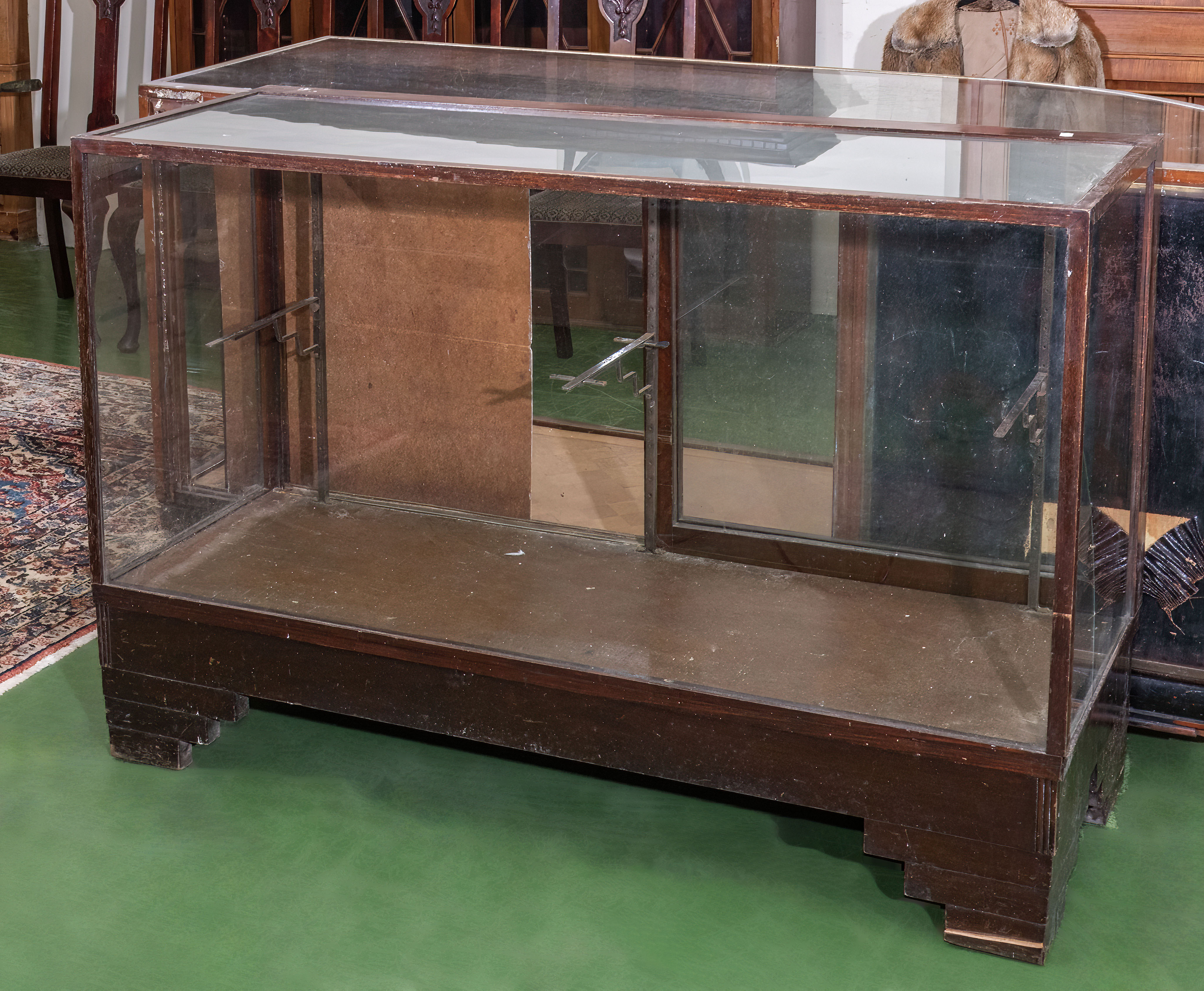 A large Edwardian wood framed glass shop display, signs of woodworm 137cm wide x 50cm deep x 91cm