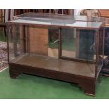 A large Edwardian wood framed glass shop display, signs of woodworm 137cm wide x 50cm deep x 91cm