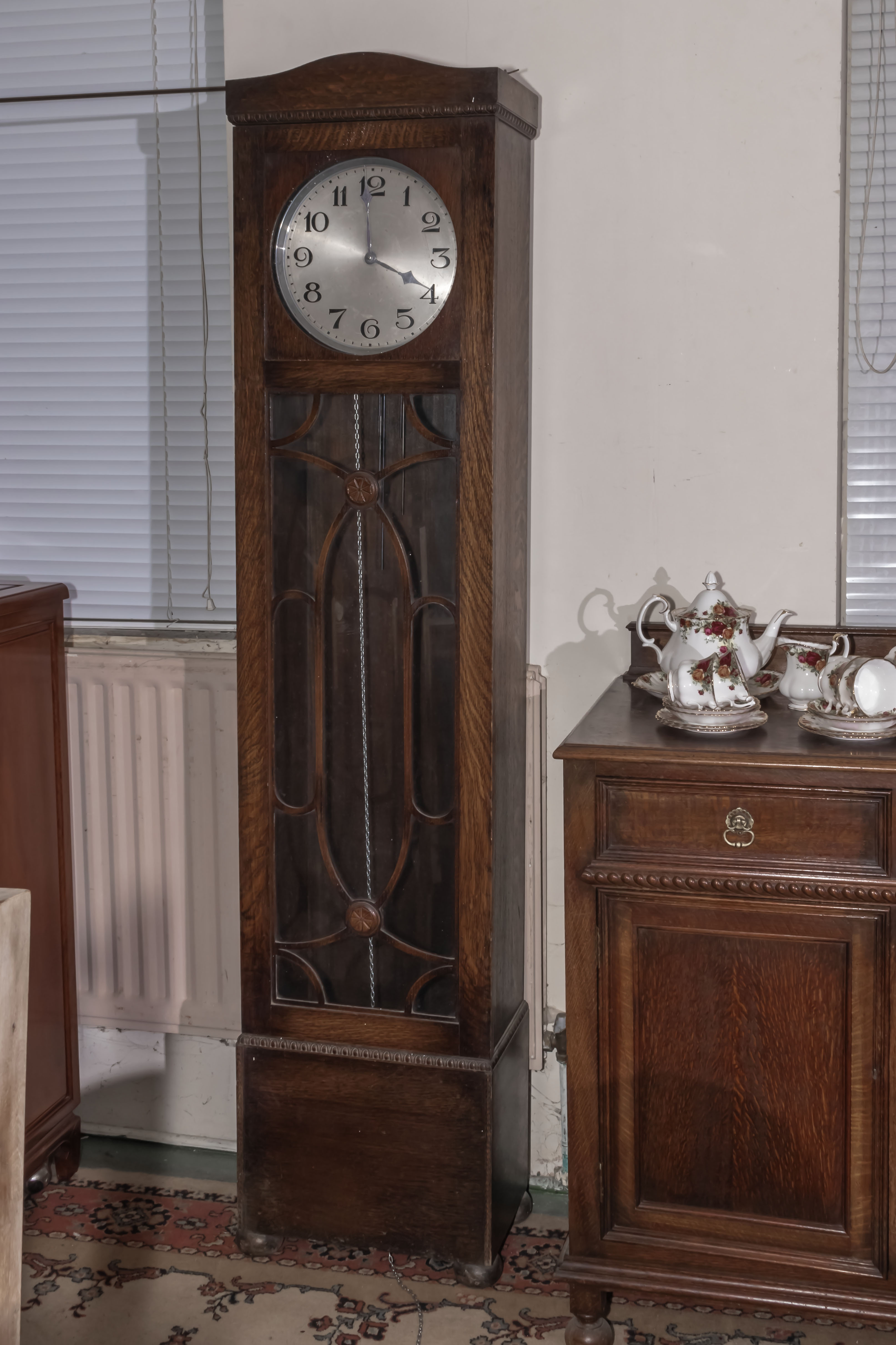 An Art Deco grandfather clock with 3 weights.