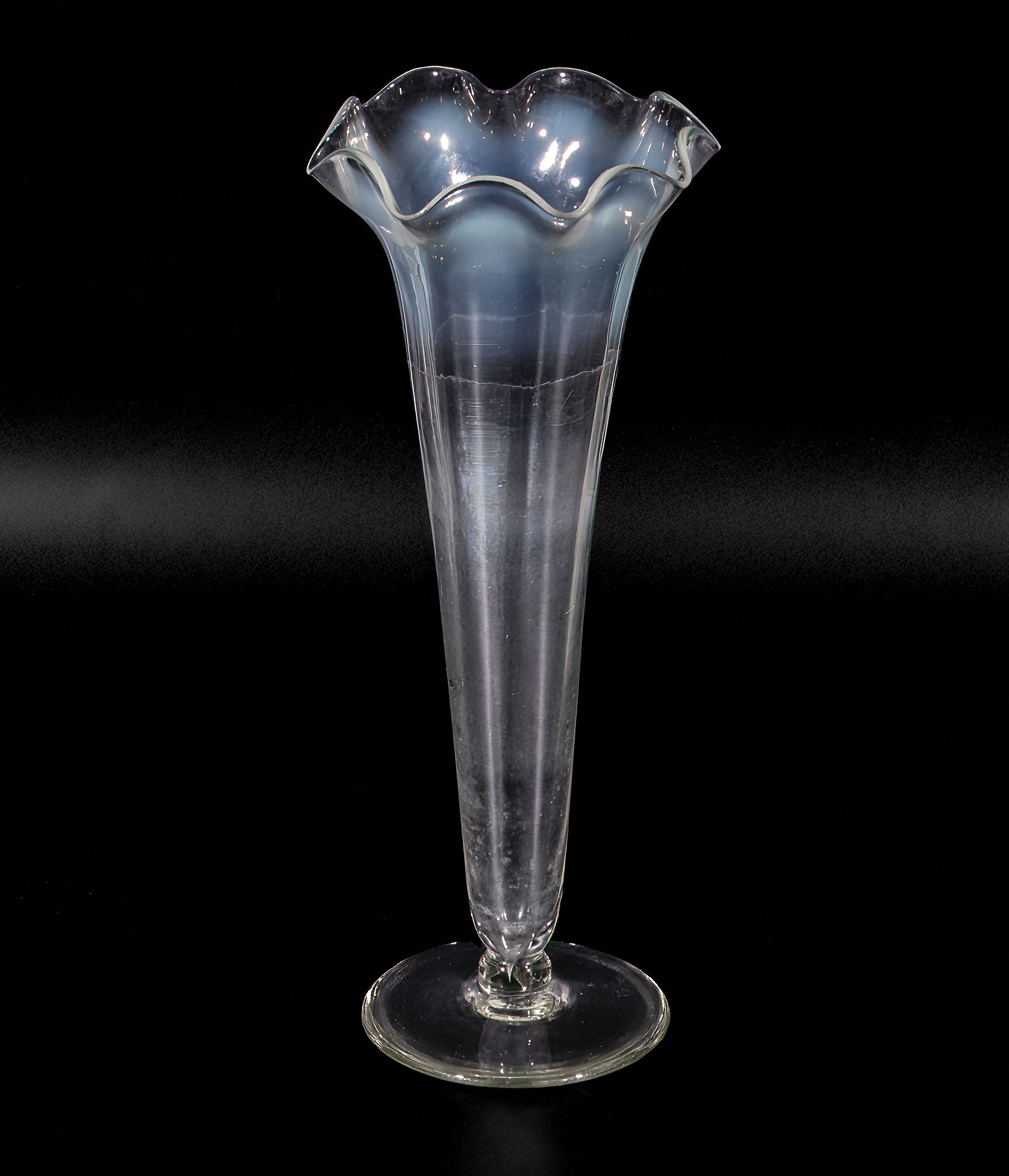 A vaseline glass bud vase 19cm tall