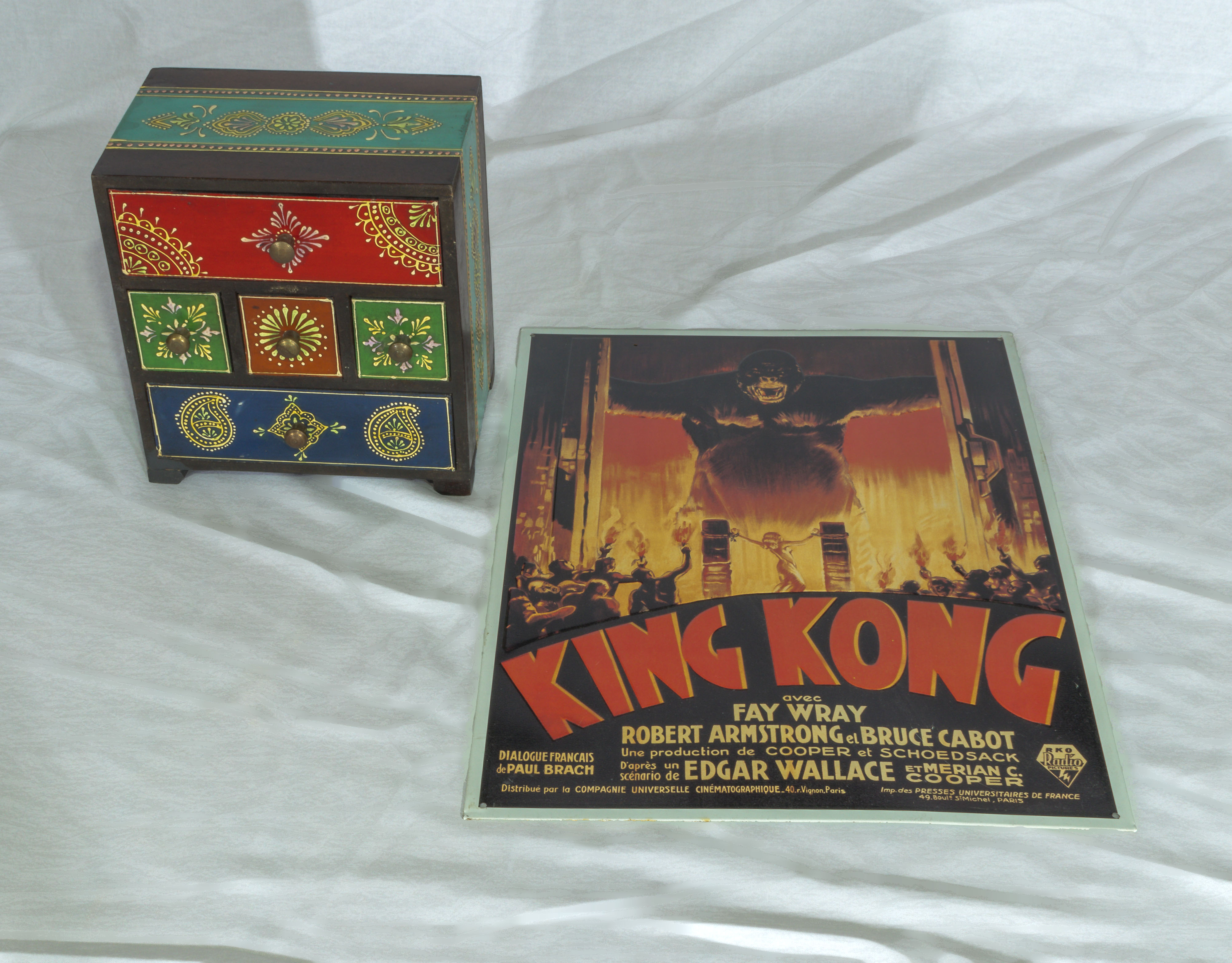 A metal King Kong poster and a jewellery box