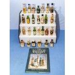 Collection of miniature whisky and a Scotch Whisky book
