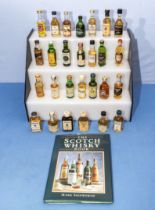 Collection of miniature whisky and a Scotch Whisky book