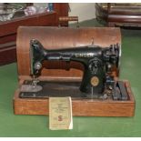 Table top Singer sewing machine with electric pedal