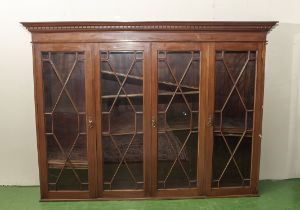 Edwardian lattice four door bookcase with dog tooth moulding, 195cm wide x 38cm deep x 145cm tall