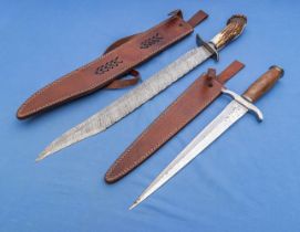 Two Damascus steel knives with leather sheaths