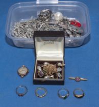 A box of costume jewellery chains, necklaces and rings