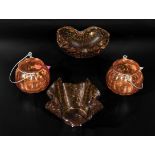 Four pieces of amber coloured glass