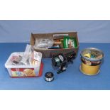 Intrepid fishing reel with spool and three boxes of assorted fishing tackle