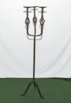 A cast iron candle stand