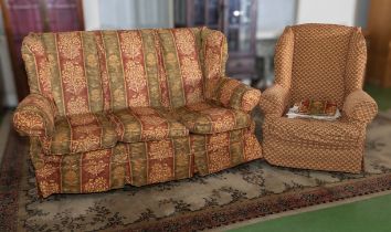 A Liberty three seater wing backed sofa and a matching armchair