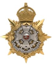 Badge. Border Regiment Officer's helmet plate circa 1901-14. Fine scarce gilt crowned star mounted