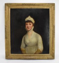 British School, 19th century depicting a half portrait of a seated lady, in the Regency fashion,