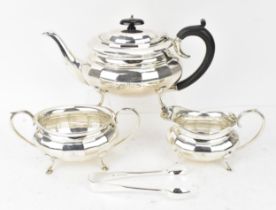 A George V silver three-piece tea set by William Adams Ltd, Birmingham 1927, comprising a teapot,